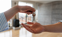 image of handing keys to a new property